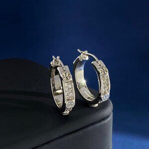 Tory Burch's sophisticated, fashionable, and versatile diamond hoop earrings